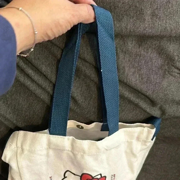 Hello Kitty white canvas tote with blue handles. - Picture 4 of 7